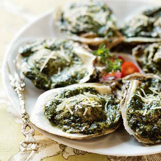 Oysters on the half shell topped with spinach, cheese and golden breadcrumbs.