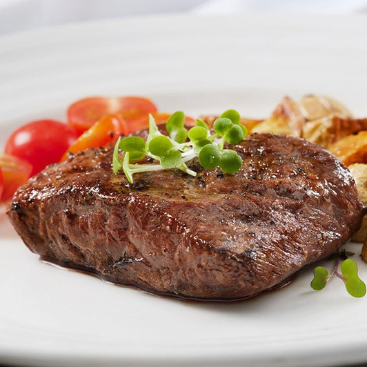 Marinated Flat Iron Steaks arranged for serving