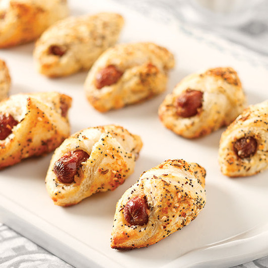 Everything-style pastry-wrapped beef franks with a seed and cheese topping