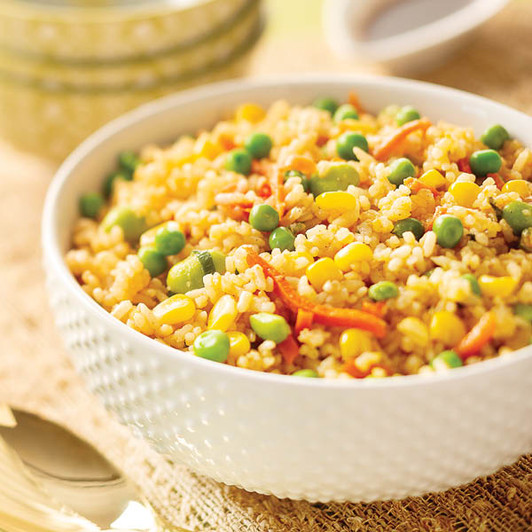 Vegetable fried rice with mixed vegetables in a serving bowl