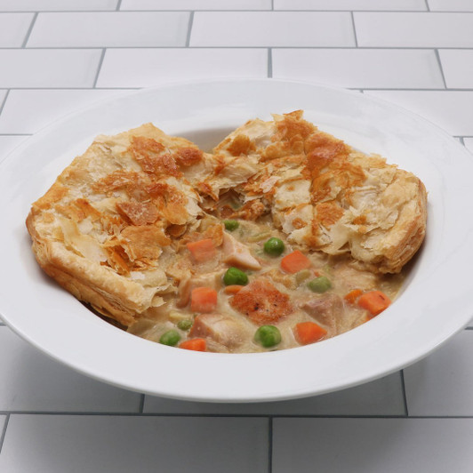 Classic chicken pot pie with flaky puff pastry crust and creamy chicken and vegetable filling
