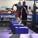 Athlete running across Tilting Blocks