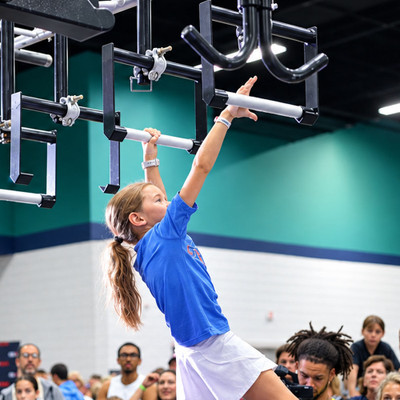 Athlete using Floating Monkey Bars with Aluminum Pegs