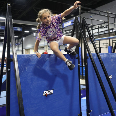 Athlete scaling Wall Jump