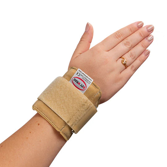 Gymnast wearing a EZY Pro Wrist Support Brace without removeable palm pad front of right hand