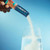 Pouring Grapefruit Liquid I.V. powder into a glass of water