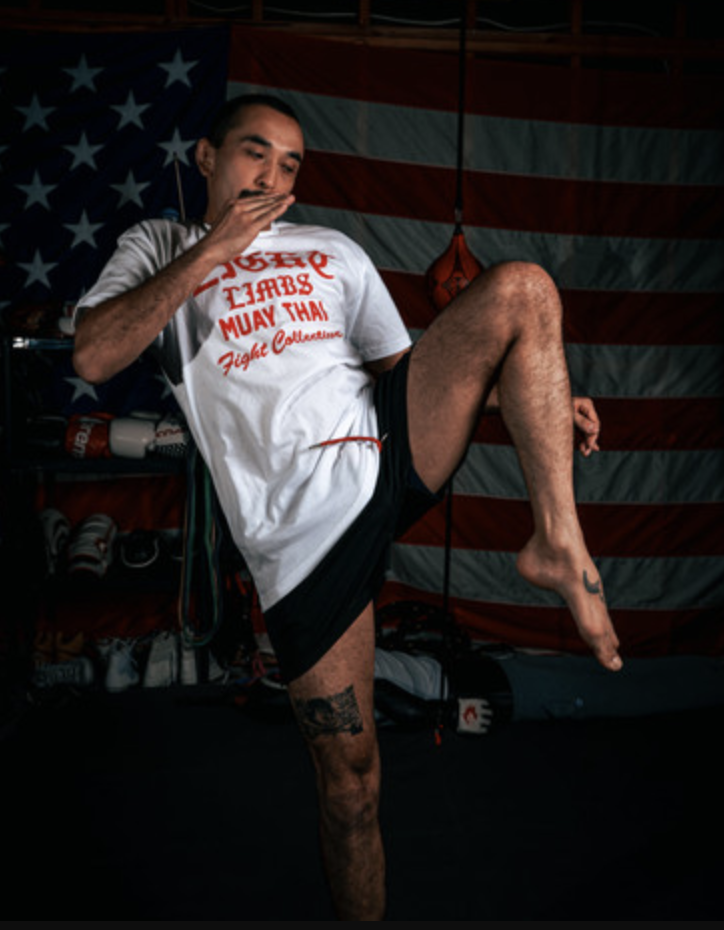 Eight Limbs Collective fighter throwing a knee