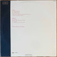 Actual image of the back cover of Los Lobos's La Pistola Y El Corazón second hand vinyl record taken in our record shop