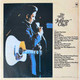 Actual image of the back cover of Johnny Cash's The Best Of second hand vinyl record taken in our Melbourne record shop