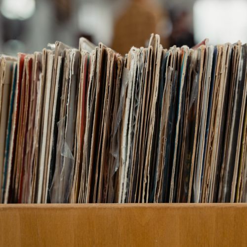A picture of an old collection of second hand vinyl records which links to information about how to sell your vinyl to the Funky Duck Vinyl record store
