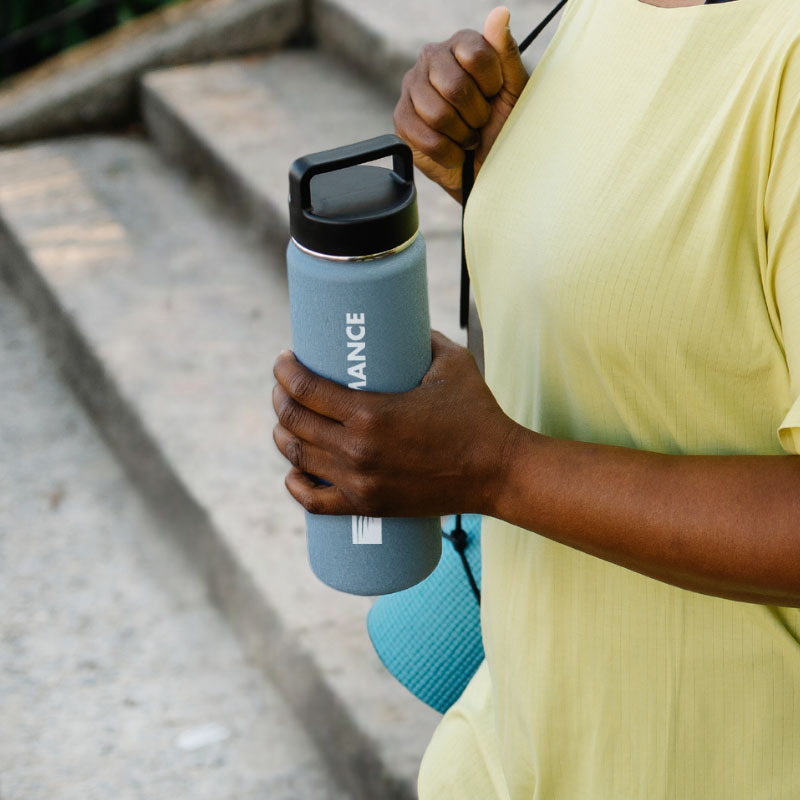woman holding water bottle