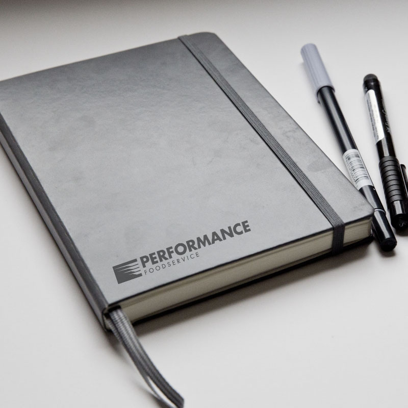 black journal and pens