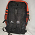 backside with shoulder straps, carry handle, and hanging J hook