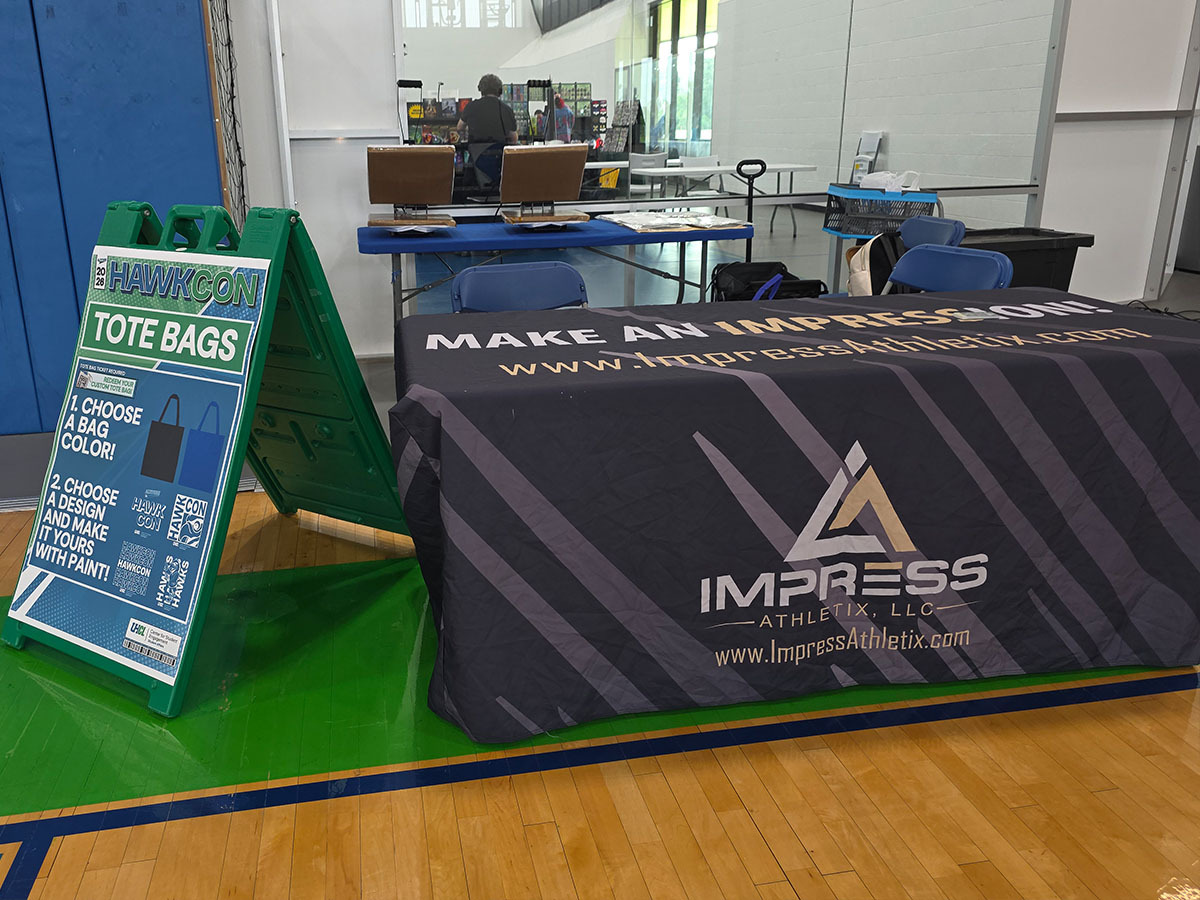 Impress Athletix indoor on-site event merchandise setup