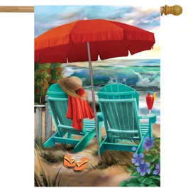 Briarwood Lane Beach Life house flag with colorful beach scene and red umbrella on sand.