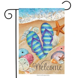 Briarwood Lane small printed garden flag with colorful beach scene, flip flops, and welcome message on sand.