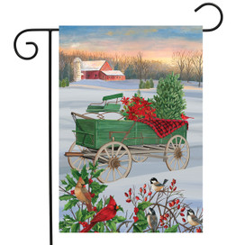 Briarwood Lane Winter Wagon Christmas Garden Flag with poinsettias, pine tree, and birds on snow scene.