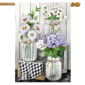 Briarwood Lane Checkered Mason Jars with colorful flowers and lilacs on a small printed decorative display.