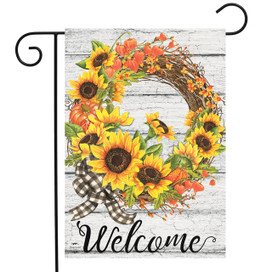 Briarwood Lane welcome garden flag with colorful fall wreath, sunflowers, and checkered bow on white wood.