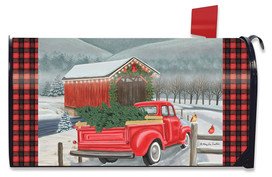 Red pickup truck with Christmas tree in bed on snowy road, Briarwood Lane festive mailbox cover.