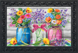 Briarwood Lane Spring Floral Jars Rustic Doormat with colorful flowers in blue, pink, and clear jars.