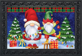 Briarwood Lane Christmas Gnomes Humor Doormat with festive gnomes and colorful Christmas trees and gifts.