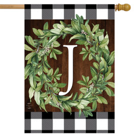 Briarwood Lane Wreath Monogram J house flag with greenery on plaid background for porch display.