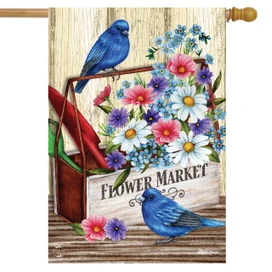 Briarwood Lane Flower Market Spring House Flag with bluebirds, flowers, and rustic toolbox on wooden deck.