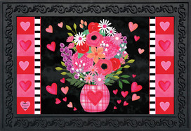 Briarwood Lane Hearts and Flowers Doormat with pink vase, flowers, and hearts on black background.