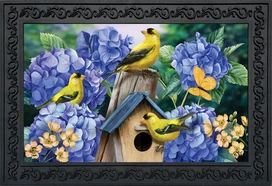Briarwood Lane Goldfinches and Hydrangea doormat with yellow birds, blue flowers, and wooden birdhouse design.
