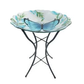 Briarwood Lane Glass Blue Butterfly Bird Bath with metal stand and leaf design on white background.