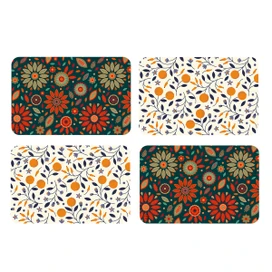 Four colorful floral placemats, Dining in Style brand, 4-pack, with orange, white, and green designs.