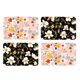 Four Bold Florals Placemats, pink and black floral designs, white flowers, green leaves, colorful blooms.