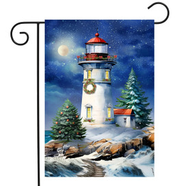 Wonderland Lighthouse Garden Flag, white lighthouse with red roof and Christmas wreath on snowy night scene.