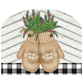 Brown knit Farmhouse Mittens with snowflake patterns holding green and red foliage on white wood background.