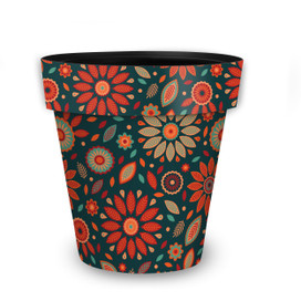 Medium floral planter with orange, teal, and red flowers on a dark background, vibrant colorful design.