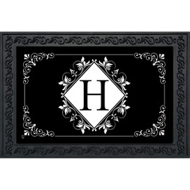 Black and white monogram doormat with floral design and large H, decorative border around white center.