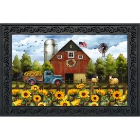 Sunflower Barn Doormat with red barn, blue truck, sunflowers, sheep and American flag design.