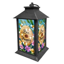 Happy Beehive Lantern with colorful floral design and "Bee Happy" text on a honeycomb pattern.