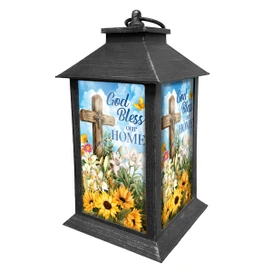 God Bless Our Home Lantern with floral design and cross on a black metal frame.