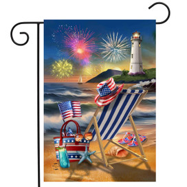 Oceanside Fireworks Garden Flag with beach scene, lighthouse, fireworks, and patriotic decorations on a flag.