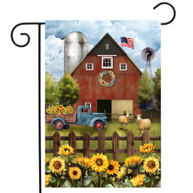 Sunflower Barn Garden Flag with red barn, blue truck, sunflowers, and sheep on a garden flag.