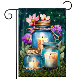 Be a Light Jars Garden Flag with lit candles in jars and flowers outdoors.
