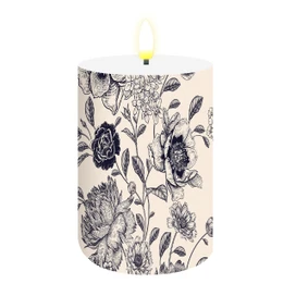 Woodcut Floral Flameless Candle, cream-colored with black floral design and yellow flame tip visible.