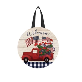 Red truck with flowers and American flags on a wood door hanger with black straps.