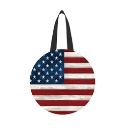 American flag design on a round tote bag with black straps and red, white, blue colors.