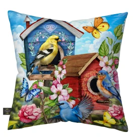 Floral Birdhouses Indoor Outdoor Pillow with colorful birds, butterflies, and flowers on vibrant blue background.