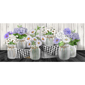 Mini checkered mason jars mat with floral design on black and white checkered background surface.