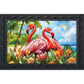 Vibrant pink flamingo pair on tropical beach with flowers, palm trees, and ocean in background doormat.