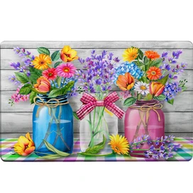 Spring Floral Jars Comfort Mat with colorful flowers in blue, clear, and pink jars on plaid.